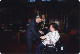 Roméo LeBlanc presents certificate to Paralympic athlete in council chambers, Mayor Philip Owen i...