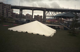 Canopy for stage on grass underneath Granville Street Bridge
