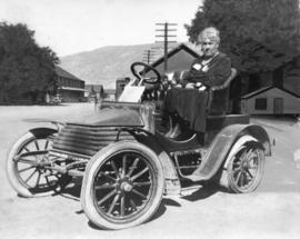 [Mrs. J.Z. Hall sitting in the first car delivered to Spences Bridge]