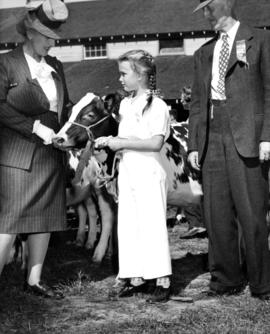 Young girl with cattle at Boys' and Girls' Department event