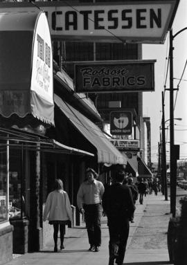 Storefronts and sidewalk on Robson Street