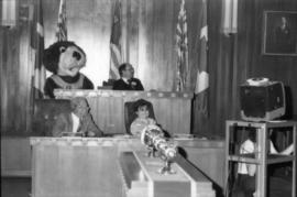 Tillicum, Mike Harcourt, Robert Henry and Maria Kinsella seated in council chambers