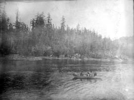 Canoers on body of water