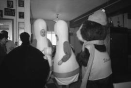 Tillicum and three people dressed as bowling pins and a bowling ball