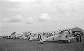 [Row of navy biplanes]