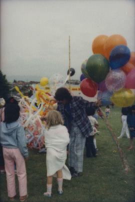 Balloon twister talking to child