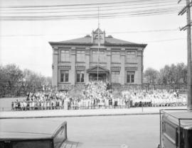 Central School with pupils [standing outside]