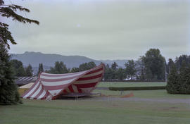 Stage under red and white striped canopy at Stanley Park