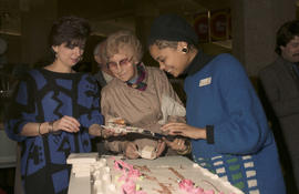 Serving cake during Legacies Program event at The Bay