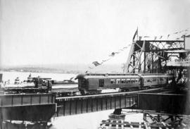 [A Vancouver, Westminster and Yukon Railway Company train crosses the bridge]
