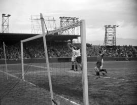 [Soccer game and crowds watching from stands at Athletic Park]