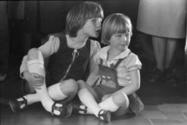 Children seated on floor