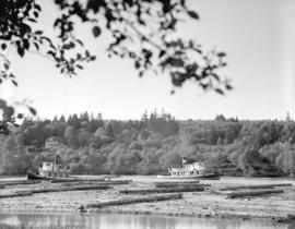 Boats and logs on Fraser River