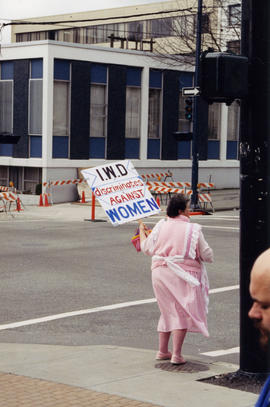 International Women's Day demo 1997 [I.W.D. discriminates against women placard]