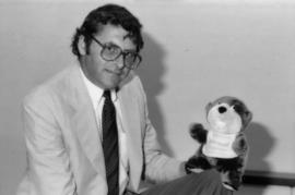 Michael Francis holds Tillicum stuffed animal