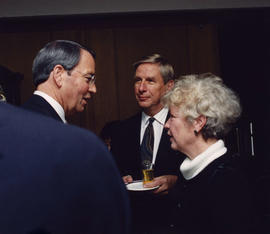 Philip Owen talking with unidentified man and woman after civic recognition ceremony