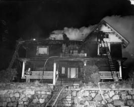 8:06 pm Monday Dec. 26/55 1131 Beach Ave [view of firefighters putting out house fire]