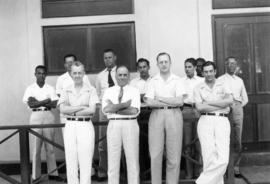 Ozama office staff posed outside building