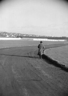 [Man walking along track at Hastings Park]