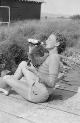 Louise Mary drinking from a bottle