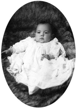 Portrait of infant on fur rug