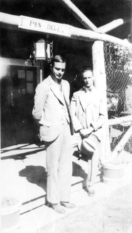 [Ken Taylor and George J. Fowler's son standing in front of Fowler's summer home 'Pen Dell']