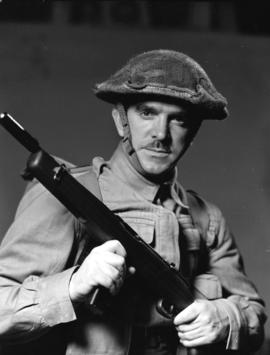 Corporal A.M. McLean [holding a rifle]