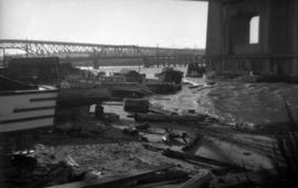 Boats on shoreline under north end of Burrard Bridge