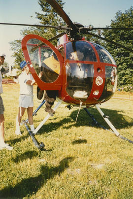 Tillicum boarding a helicopter