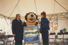 Tillicum at podium during Vancouver AM sign unveiling at Oak Street and 71st Avenue