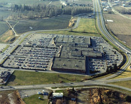 [Aerial view of shopping centres]