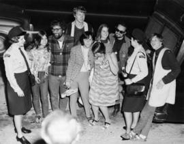 [Two female police officers with group of young people]