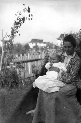 Annie [Louise] and Kenneth [Taylor in yard of house at Willow Street and 8th Avenue in] Fairview,...