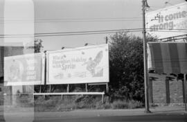 [Billboard advertisements adjacent to 2676 West Broadway]