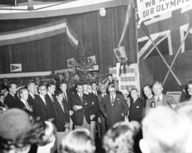 [Canadian Olympic Team members are welcomed by officials at a reception at the airport]