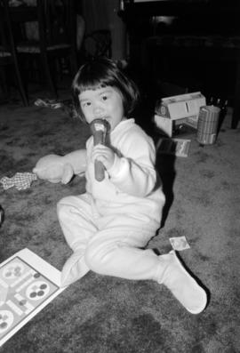 Young girl playing in a living room