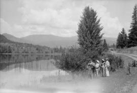 Small group watching something across the lake