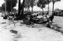 Riot damage, burned car at the Hotel Majestic