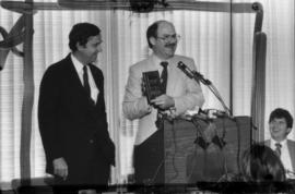 Daniel Colussy and Mike Harcourt at podium