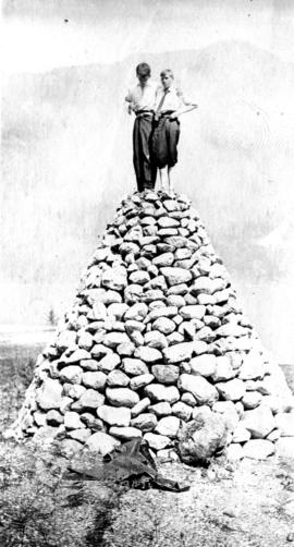 Herbert Purdy and Bud [Rose] on a rockery at Orlomah Beach