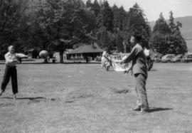 Boys playing ball at Lumberman's Arch picnic area in Stanley Park
