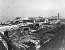 [Progress photograph of the construction and lumber yard for the CPR Pier "B/C" superst...