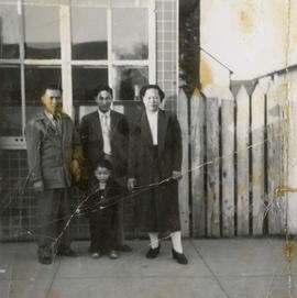 Gordon, Guy, Vernon, and Gum May Yee in front of Gordon's café in Naicam, Saskatchewan
