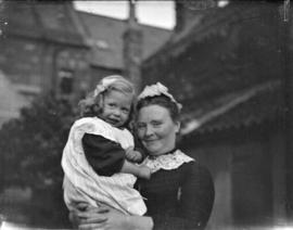 [Jean Davidson being held by unidentified woman]