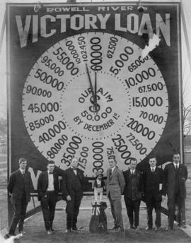 Group in front of Powell River Victory Loan billboard