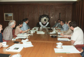 Tillicum at table with Centennial Committee members at Vancouver City Hall