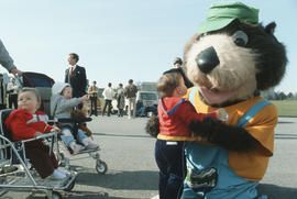 Tillicum greeting children in parking lot at Vanier Park