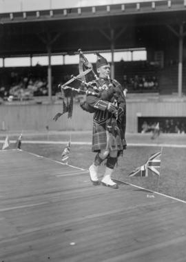 [Bagpiper playing, Caledonian Games, Athletic Park]