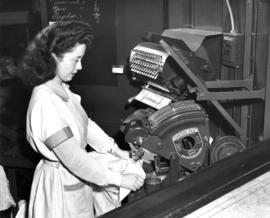 Nelson's staff person demonstrating shirt pressing on a Fantom-Fast machine