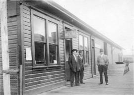 [T.F. York, W. Blatchford and Jack MacGillivray in front of the Office of G.R. Customs]